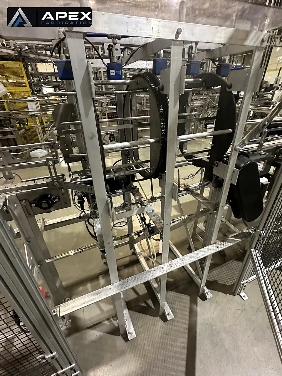 Custom aluminum-framed production machine with chain ring drive viewed through open guarding