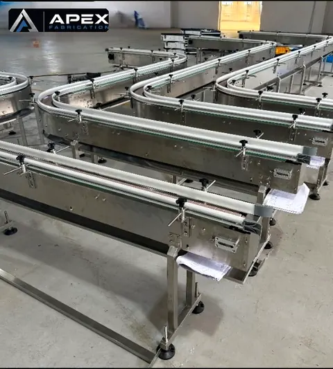 Rows of completed 880 tabletop chain conveyor sections preassembled and ready to ship
